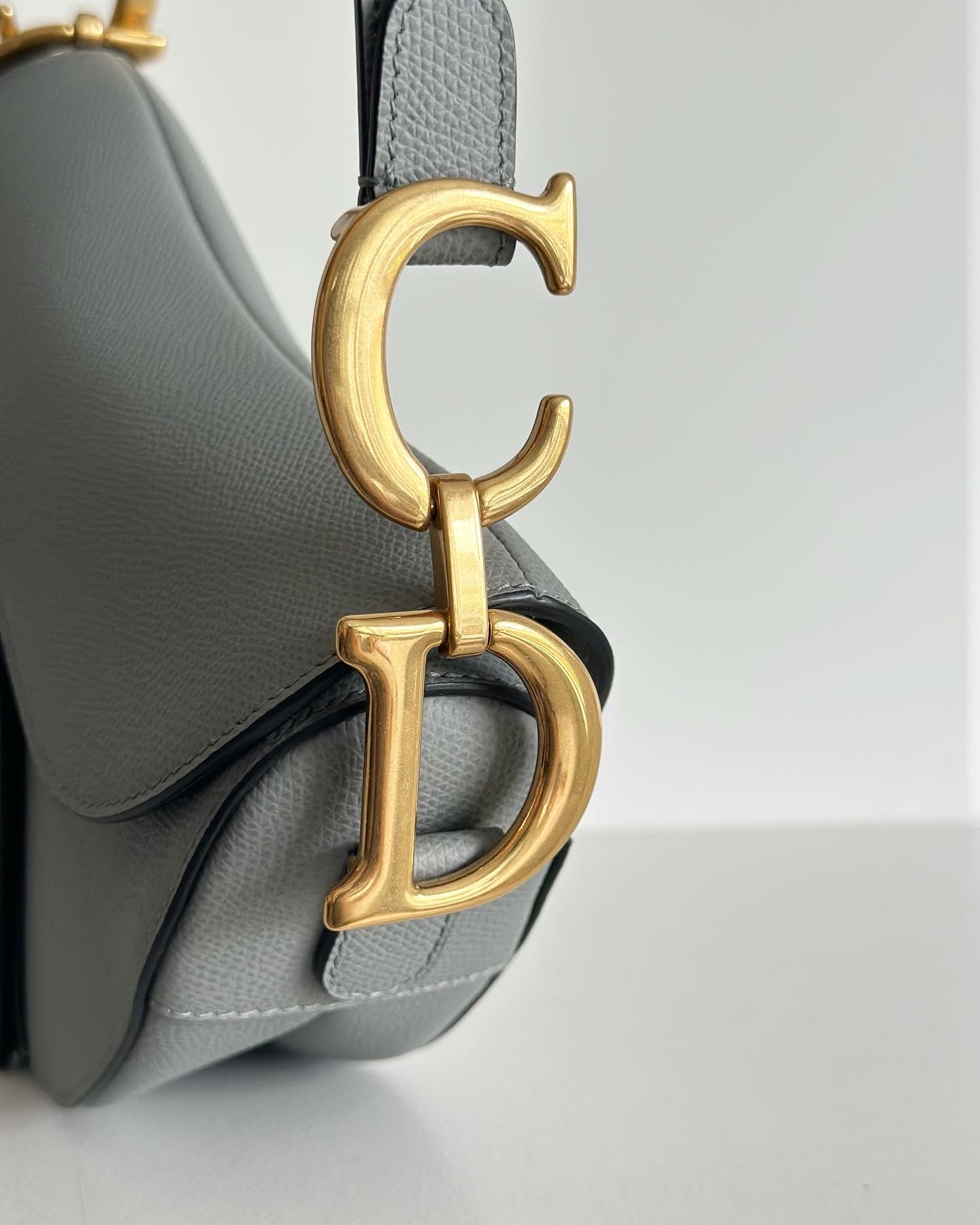 Christian Dior Medium Sage Green Grained calfskin saddle bag.